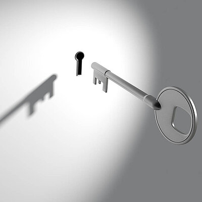 Keyhole and key Key hovering in front of a keyhole